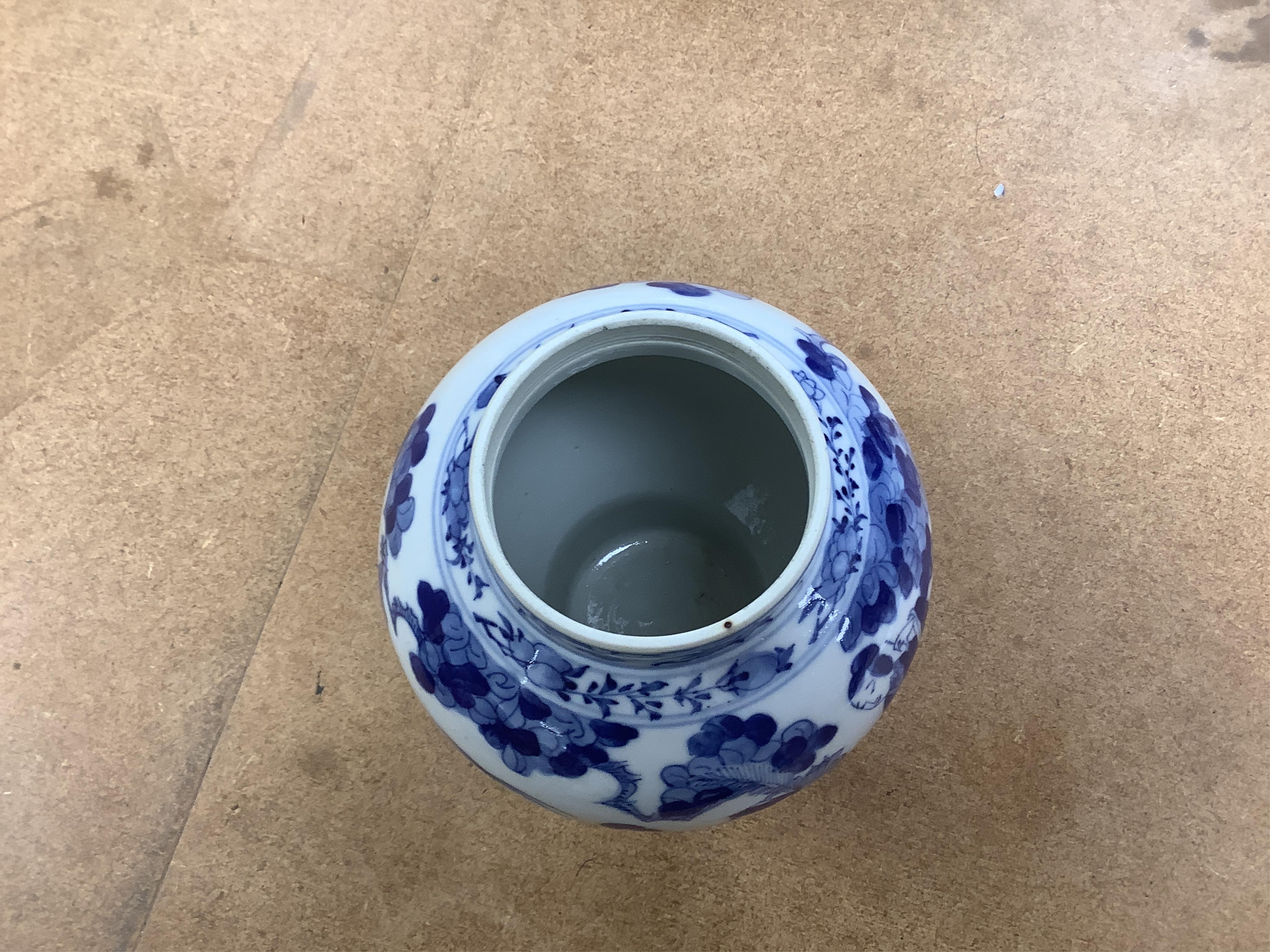 An early 20th century Chinese blue and white porcelain vase and cover decorated with figures in a landscape and a Japanese circular bowl, tallest 23cm. Condition - good